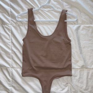Dusty rose bodysuit
Thong bottom with button closure
Extremely soft material